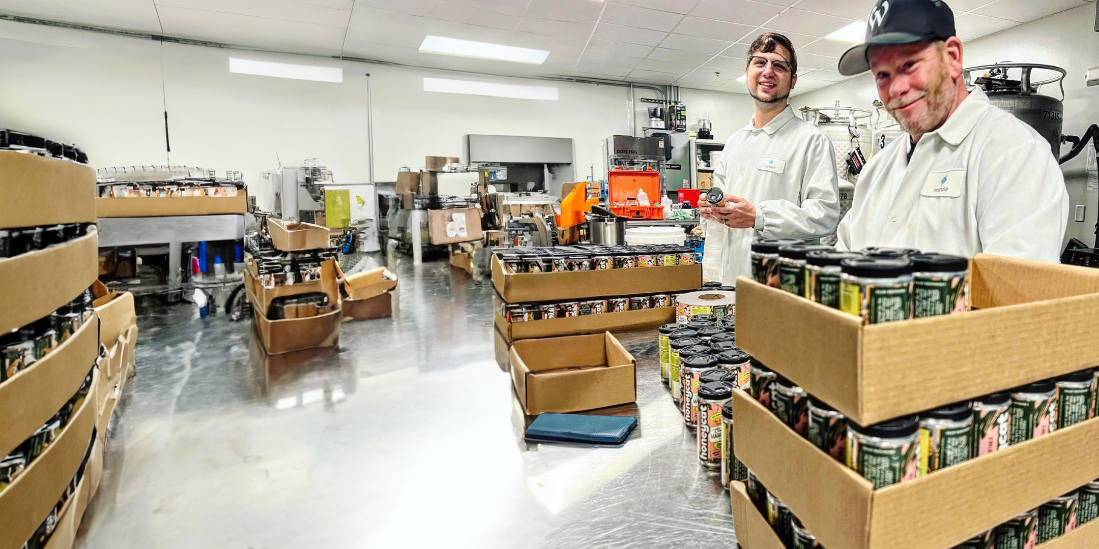 Honeycat team members canning drinks at one of our facilities.